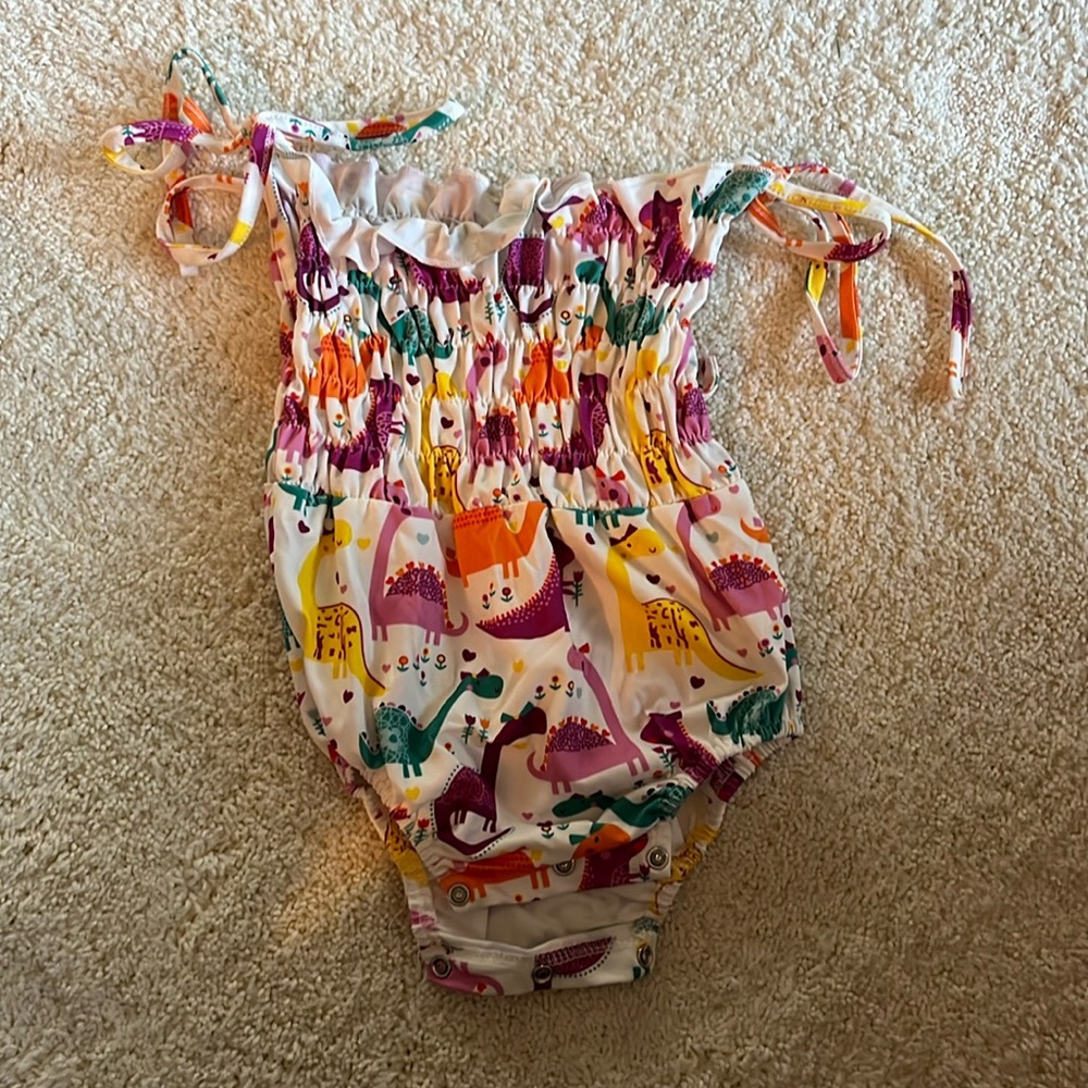 Dinosaur baby onesie